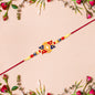 Designer Sun Motif Rakhi With Red And Blue Enamel Work
